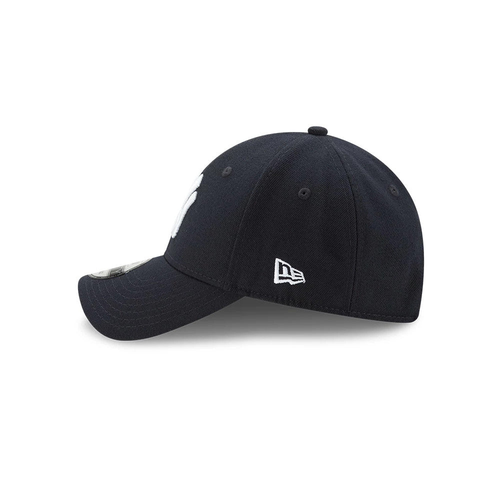 New York Yankees The League Blue New Era 9FORTY Cap, side view showing the white embroidered New Era flag logo on the left side of the blue structured crown, with a curved visor and 9FORTY size sticker.