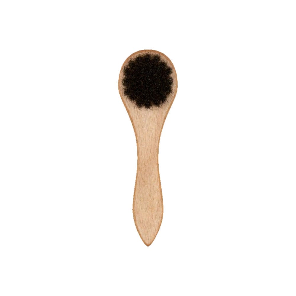This is a New Era Wooden Cap Brush 2