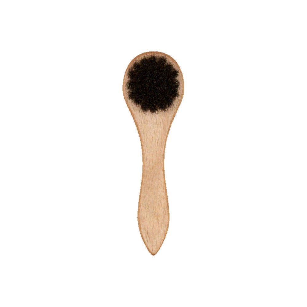 This is a New Era Wooden Cap Brush 2