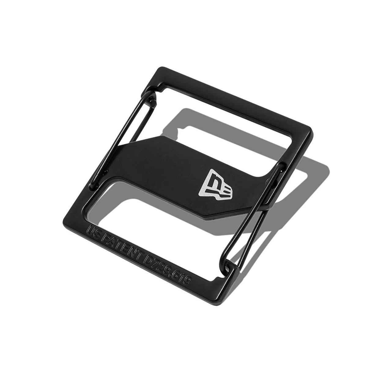 New Era Black Cap Clip, showing a sleek, rectangular design with an embossed New Era flag logo at the centre, featuring a patent number along the bottom edge of the durable black frame.