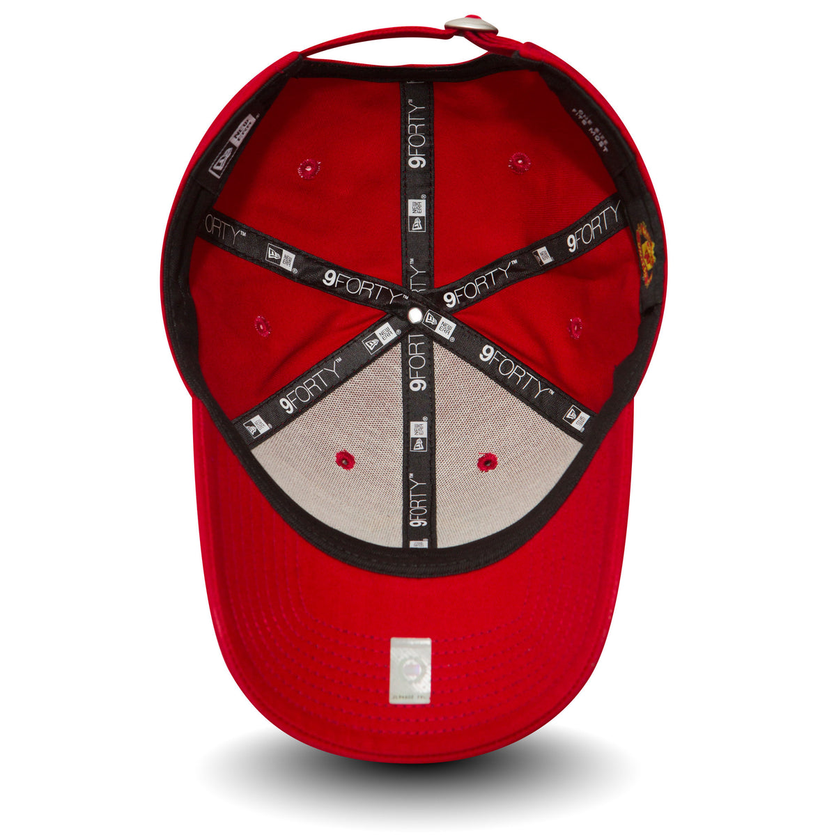 Manchester United Essential Red New Era 9FORTY Cap, inside view showing black 9FORTY-branded taping on the red panels, a grey undervisor, the sewn red eyelets and the internal sweatband lining the edge.