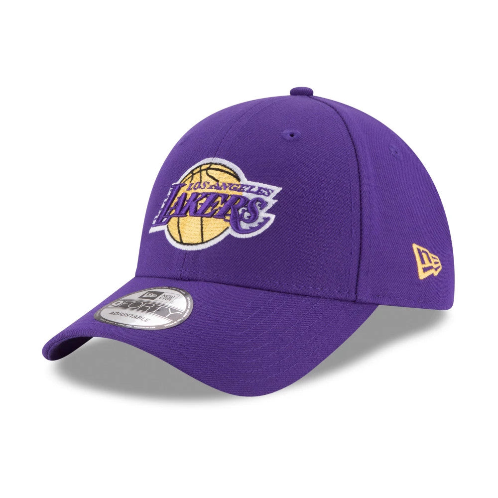 LA Lakers The League Purple New Era 9FORTY Cap, three-quarter view showing a yellow and purple Lakers logo with white embroidery on the front panel, curved visor with a 9FORTY size sticker, and New Era flag logo on the left side.