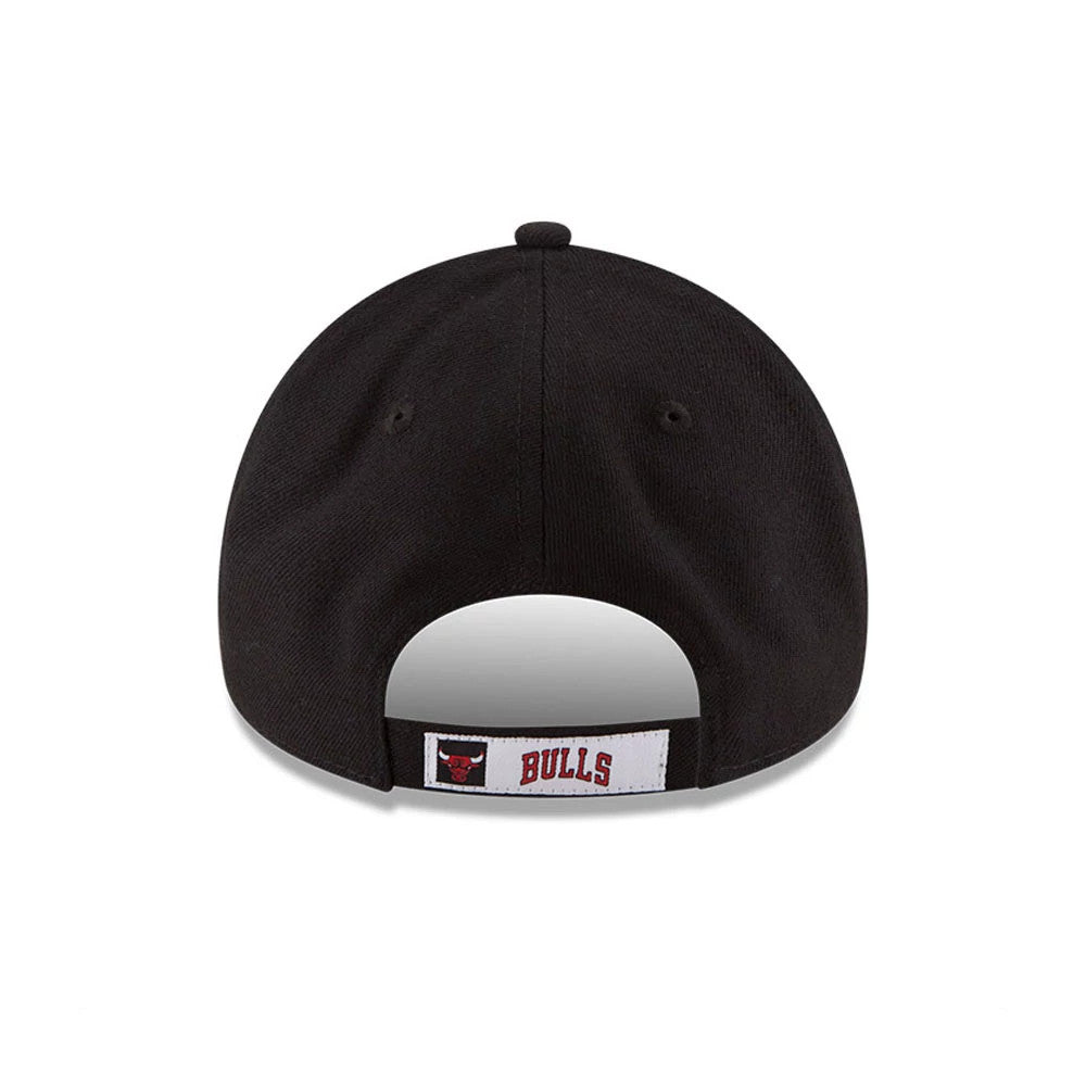 Chicago Bulls Youth The League NBA Black New Era 9FORTY Adjustable Cap, rear view showing the red and black Bulls logo and BULLS lettering embroidered on a white fabric strip above the adjustable strap at the centre back of the cap.