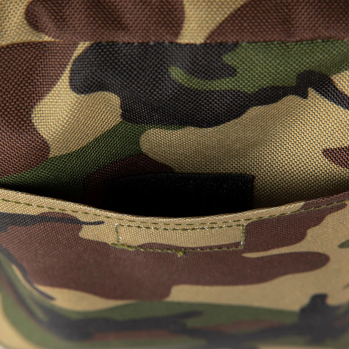 LA Dodgers Woodland Camo Side Bag, close-up view showing the camouflage pattern with green, brown, and tan hues, featuring detailed stitching across the seam of the pocket, no visible logos or additional details in the frame.