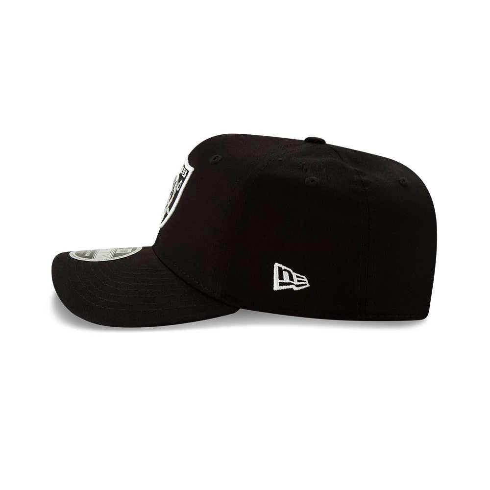 NFL Las Vegas Raiders Black New Era 9FIFTY Stretch Snap Cap, side view showing the embroidered New Era flag logo in white on the left side, with a curved visor and a 9FIFTY size sticker on top.