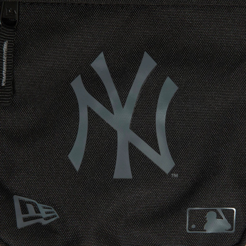 New York Yankees Logo Black Side Bag, front view showing a large grey debossed New York Yankees logo in the centre, a debossed New Era logo on the lower left corner, and a debossed MLB logo on the lower right corner.