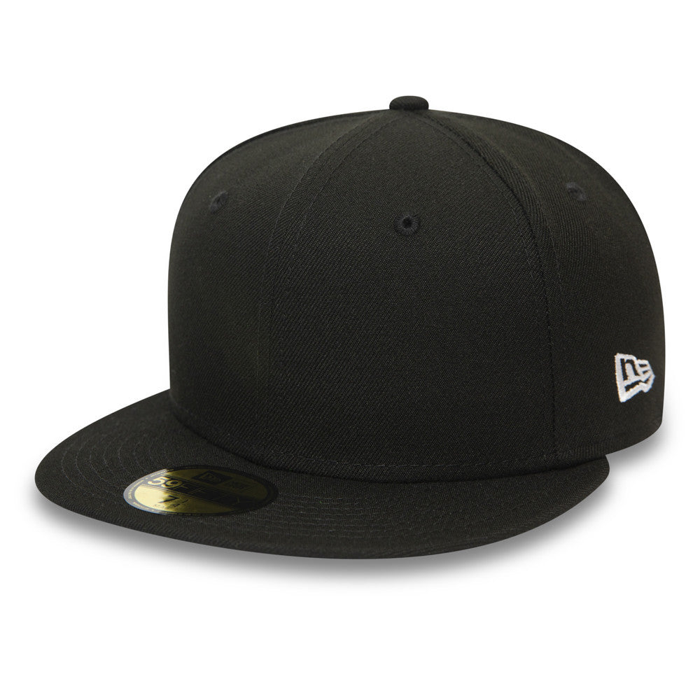 New Era Blank Essential Black 59FIFTY Fitted Cap, three-quarter view with white New Era flag logo on the left side, featuring a flat black visor and a gold 59FIFTY size sticker on top.
