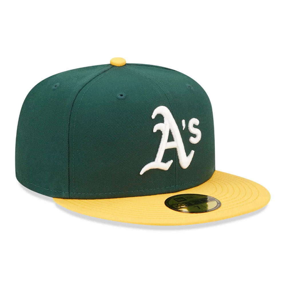 MLB Athletics Authentic On Field Dark Green New Era 59FIFTY Fitted Cap, three-quarter view showing the raised white A's logo on the front panel, yellow visor with gold 59FIFTY size sticker, and matching yellow top button.