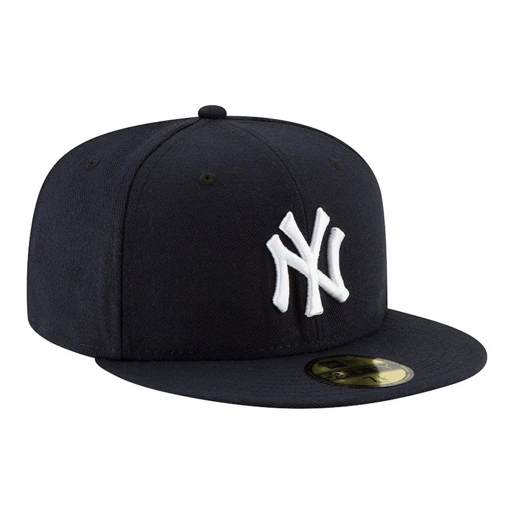New York Yankees Authentic On Field Game Navy New Era 59FIFTY Cap, three-quarter view showing the raised white embroidered NY logo on the front panel and a gold 59FIFTY size sticker on the flat navy visor.