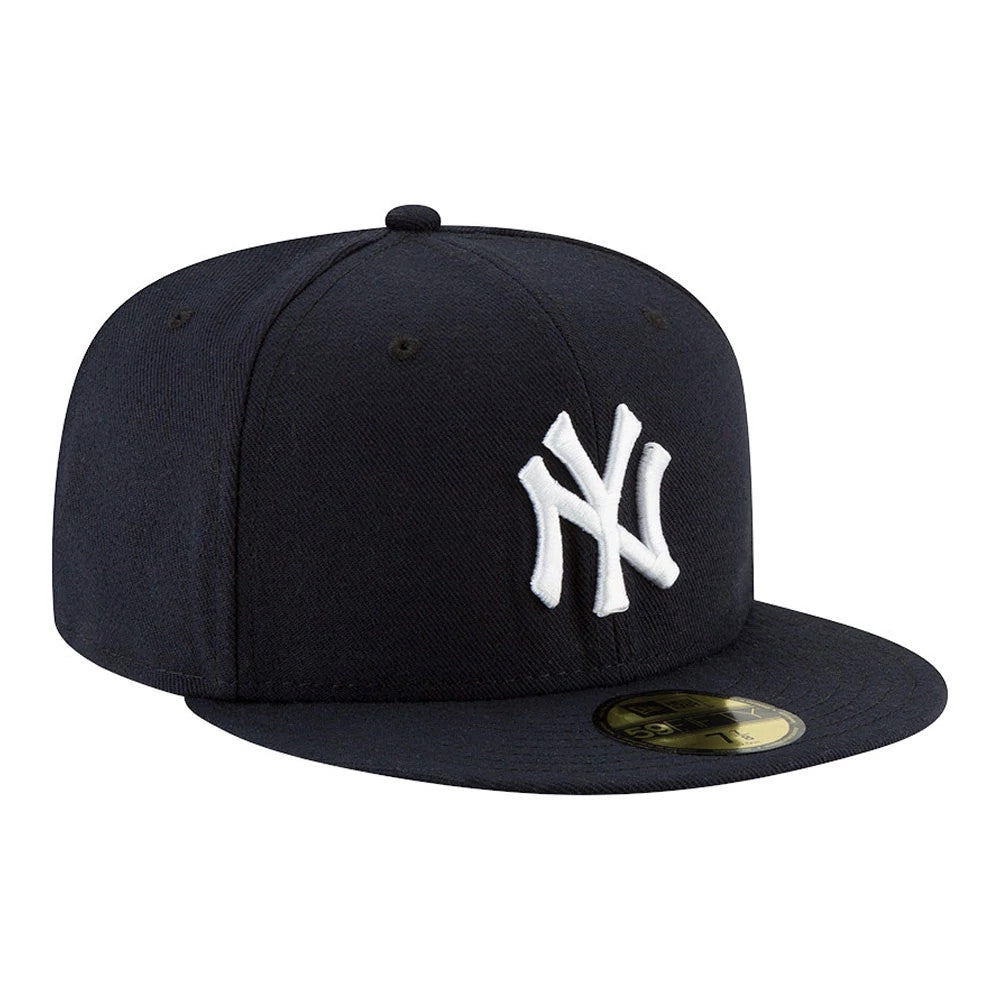 New York Yankees Authentic On Field Game Navy New Era 59FIFTY Cap, three-quarter view showing the raised white embroidered NY logo on the front panel and a gold 59FIFTY size sticker on the flat navy visor.
