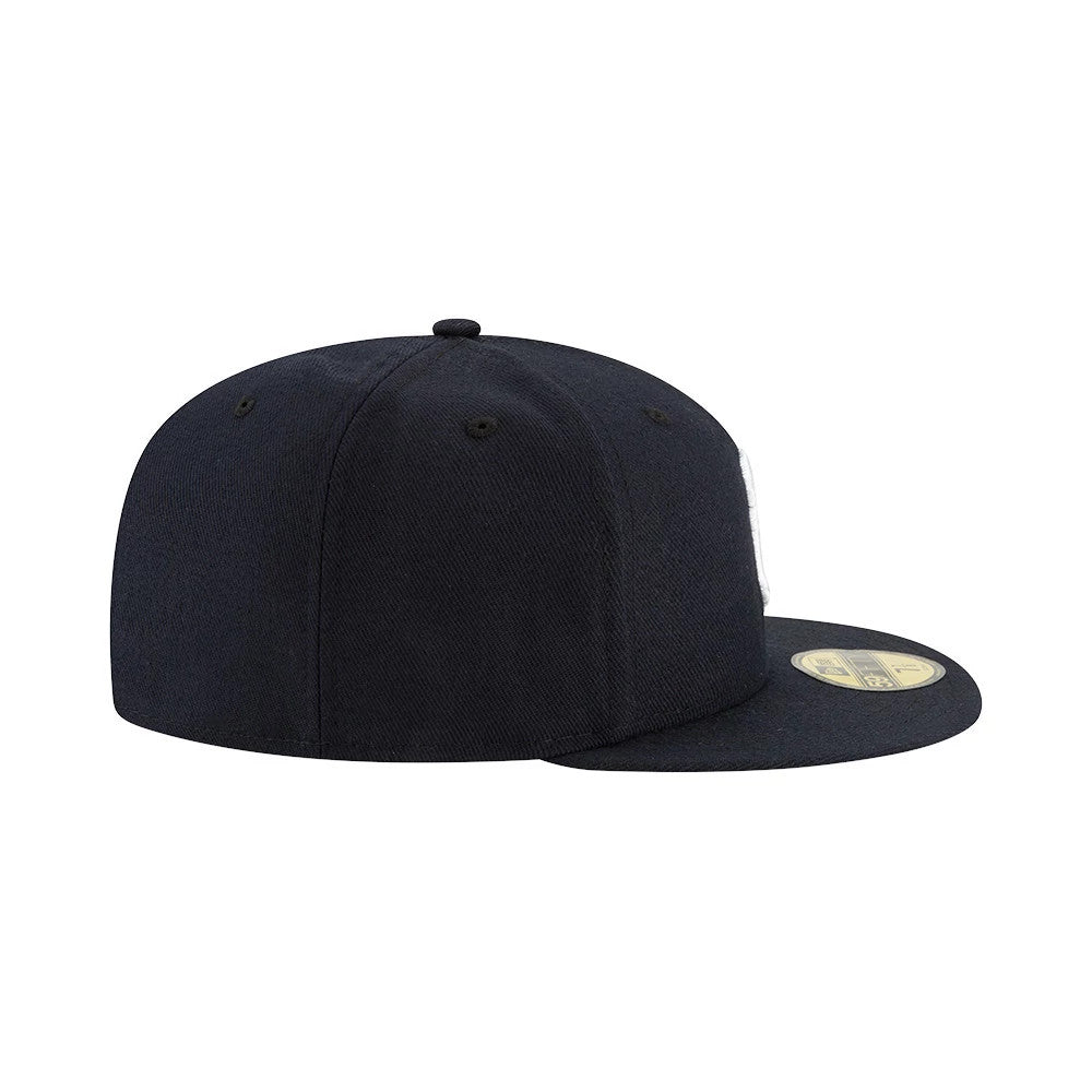 New York Yankees Authentic On Field Game Navy New Era 59FIFTY Cap, side view showing the rounded structured crown, a flat visor with a gold 59FIFTY size sticker on top, and matching navy eyelets and top button.