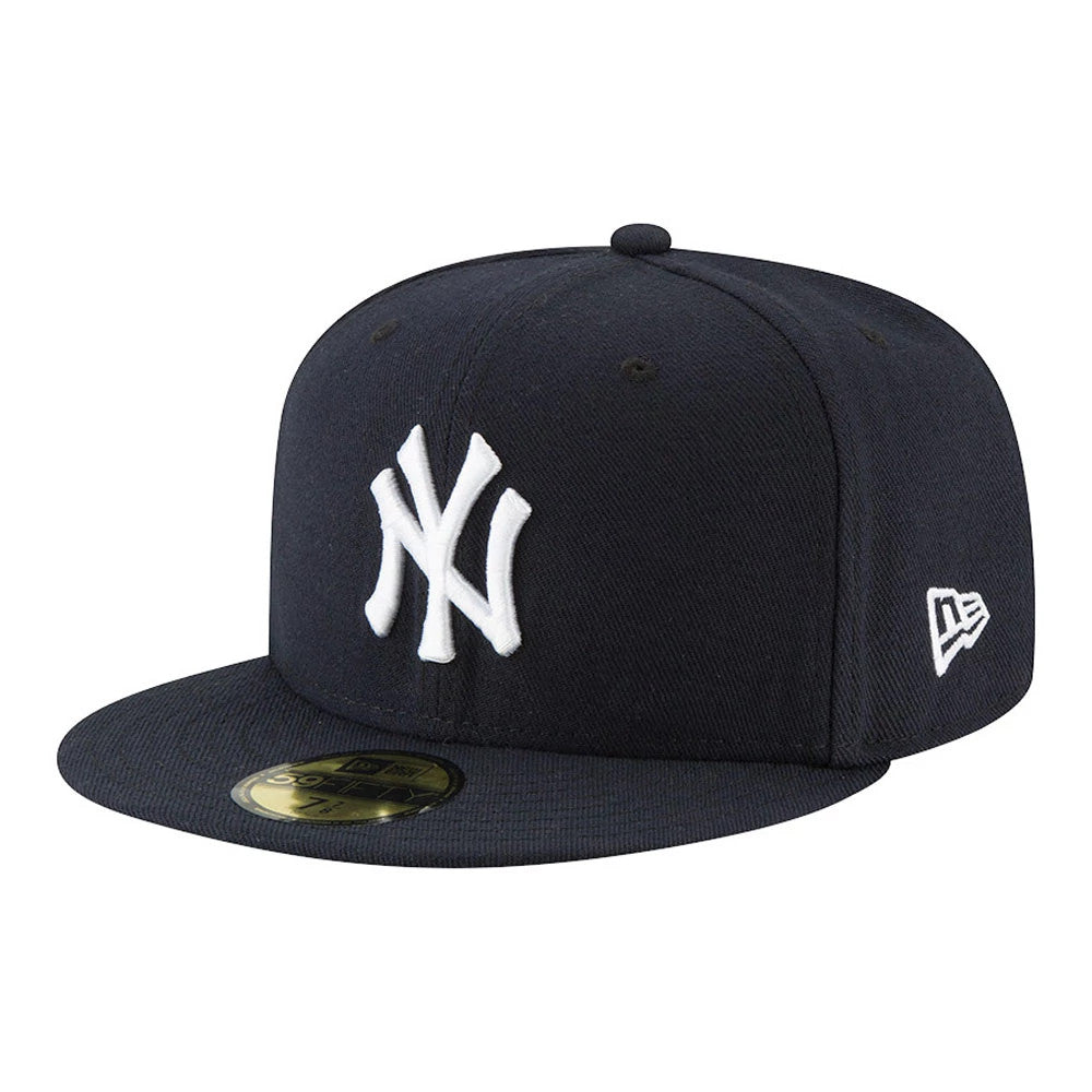 New York Yankees Authentic On Field Game Navy New Era 59FIFTY Cap, three-quarter view showing raised white NY logo embroidery on the front panel, a New Era flag logo on the left side, and a gold 59FIFTY size sticker on the navy visor.
