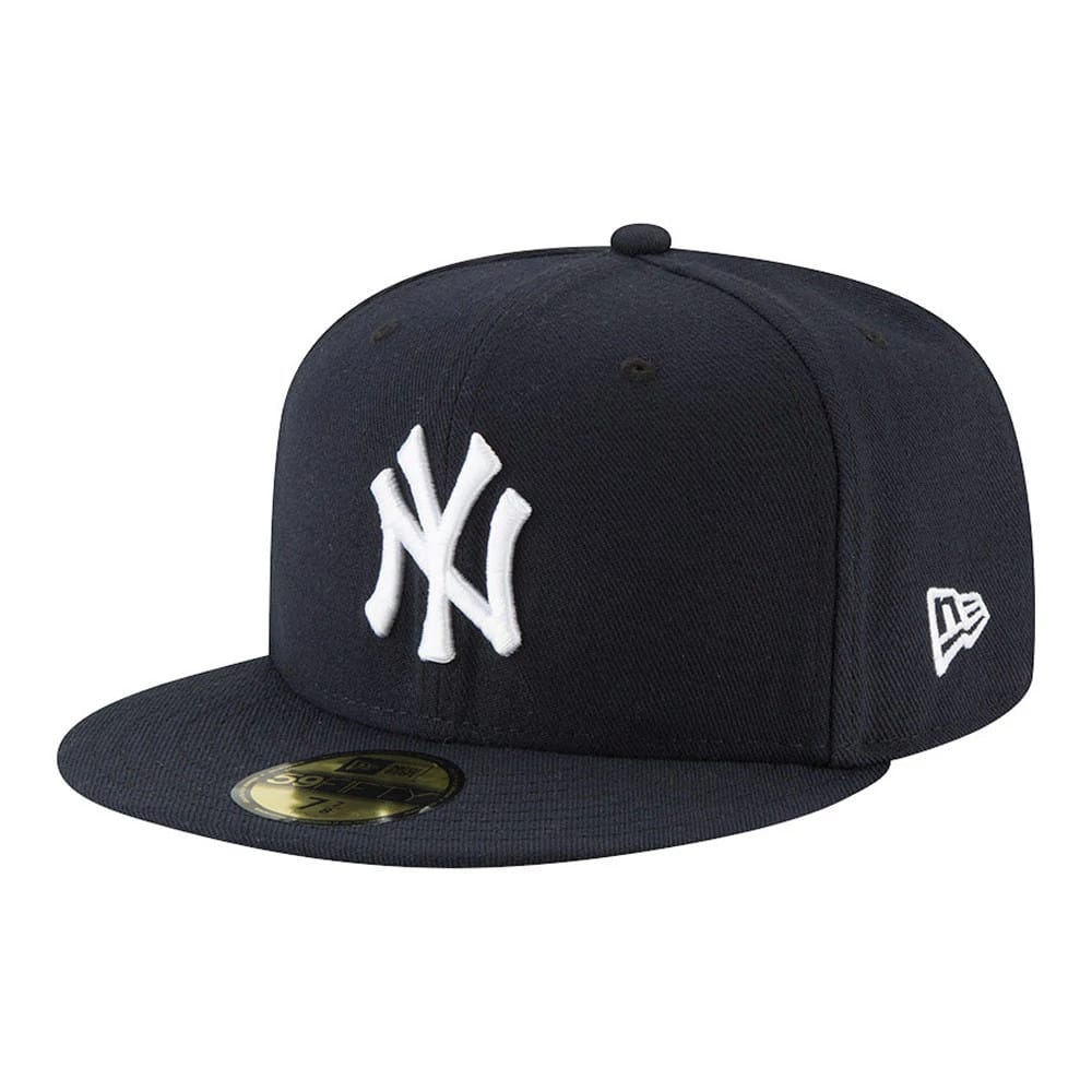 New York Yankees Authentic On Field Game Navy New Era 59FIFTY Cap, three-quarter view showing raised white NY logo embroidery on the front panel, a New Era flag logo on the left side, and a gold 59FIFTY size sticker on the navy visor.