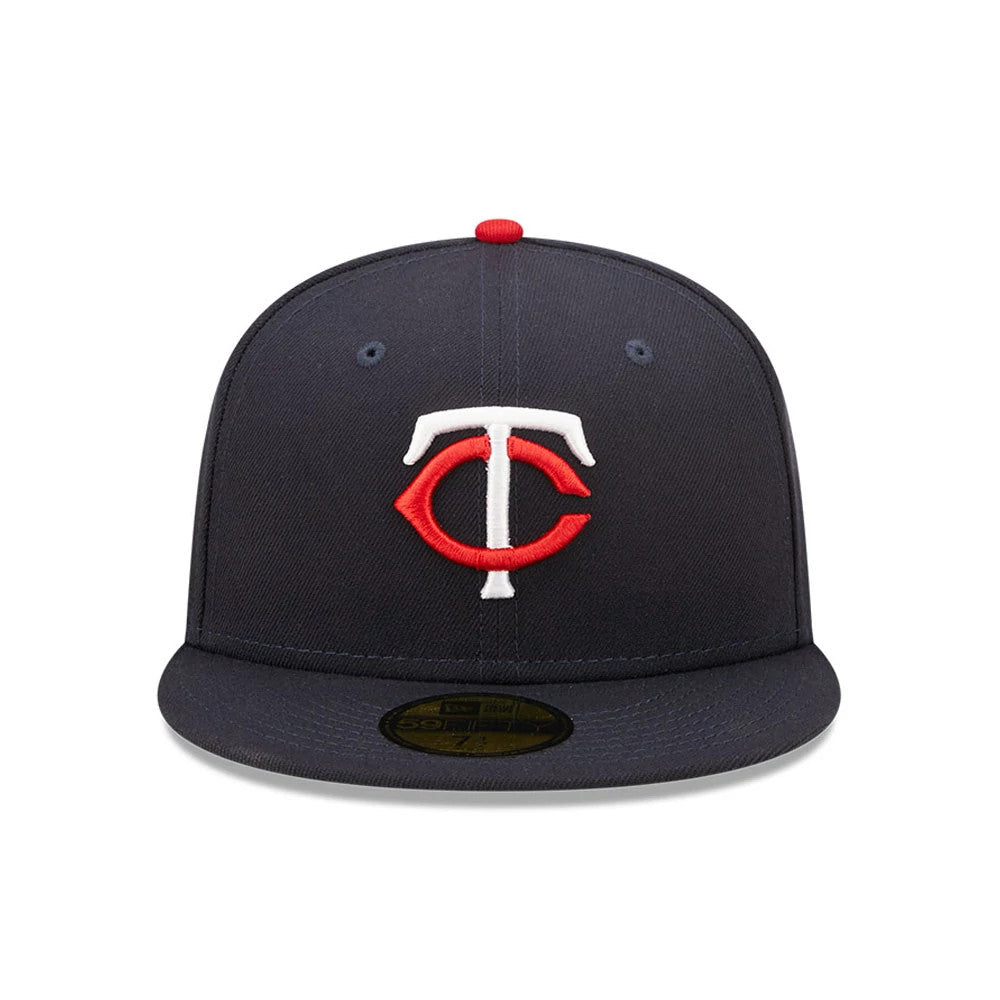 Minnesota Twins Authentic On Field Navy New Era 59FIFTY Cap, front view showing the red and white embroidered TC logo on the centre of the structured navy crown, with a gold 59FIFTY size sticker on the flat navy visor.