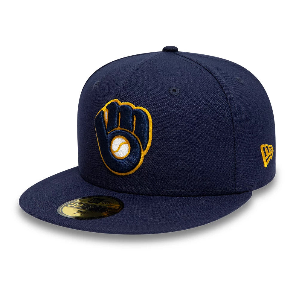 Milwaukee Brewers AC Perf Navy New Era 59FIFTY Cap, three-quarter view showing the raised yellow and white glove logo on the front panel, matching New Era flag logo on the left side, and gold 59FIFTY size sticker on the visor.