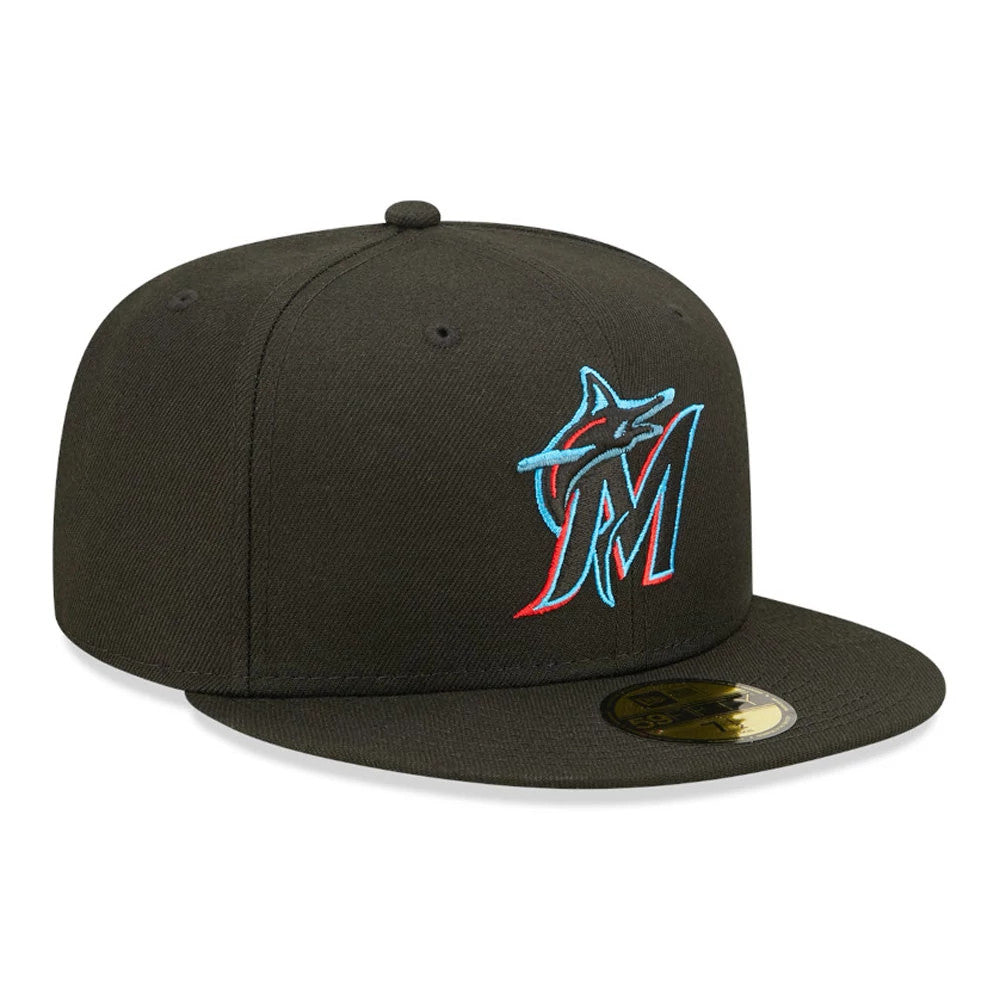 Miami Marlins Authentic On Field Game Black New Era 59FIFTY Fitted Cap, three-quarter view showing the raised teal and red embroidered Marlins logo on the front panel, flat black visor and gold 59FIFTY size sticker on top.