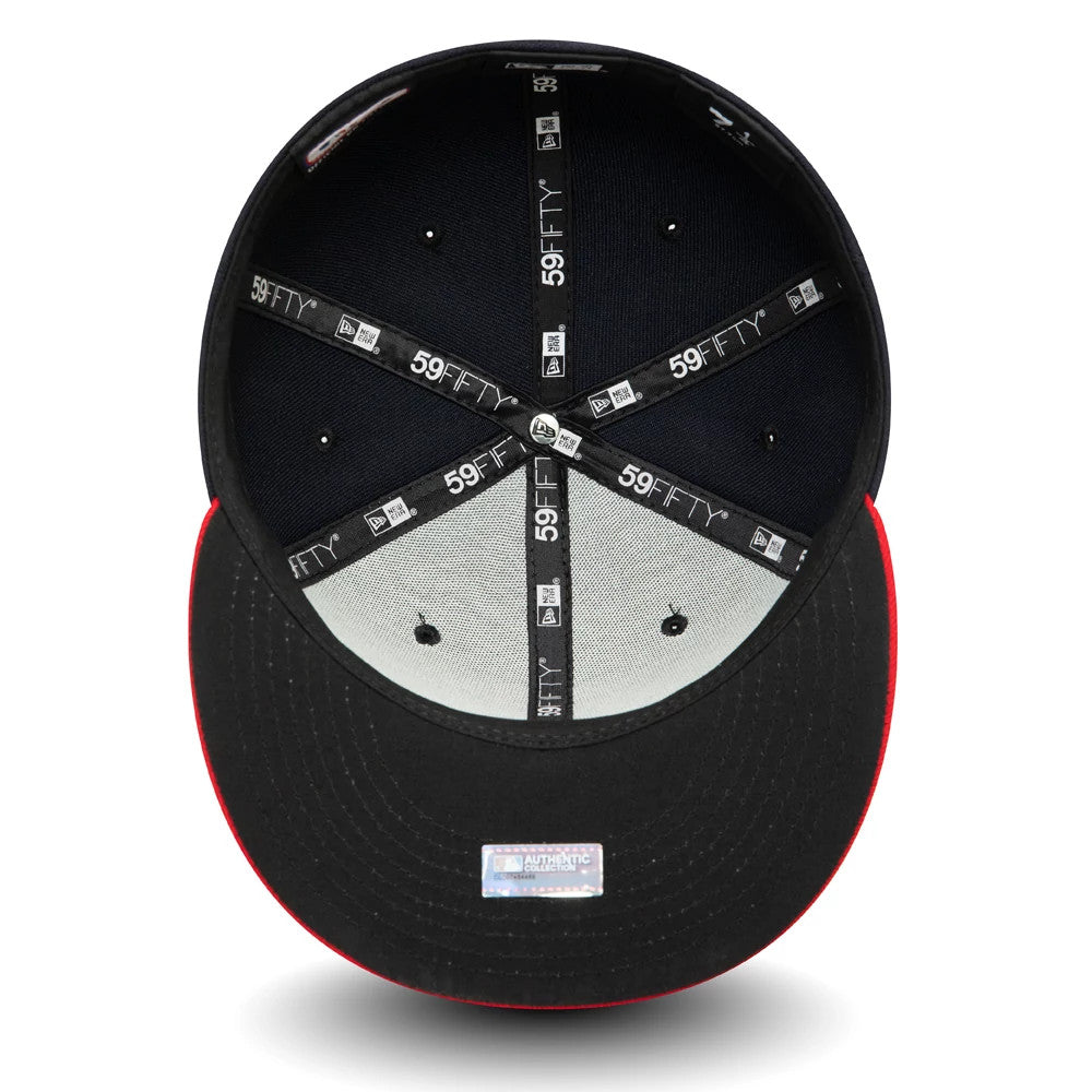 Cleveland Guardians MLB AC Perf Navy New Era 59FIFTY Fitted Cap, inside view showing black taping with 59FIFTY branding, black sweatband, grey undervisor, and a white official product sticker on the black visor.