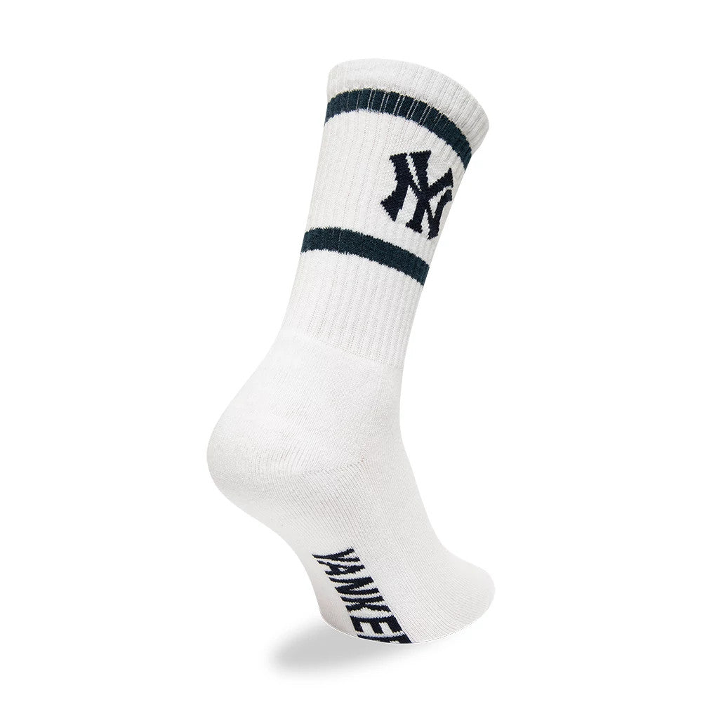 New York Yankees MLB Premium White Socks, side view showing the ribbed cuff with two dark stripes, the black embroidered NY logo on the side of the cuff, and the text "YANKEES" running vertically at the back of the white sock.