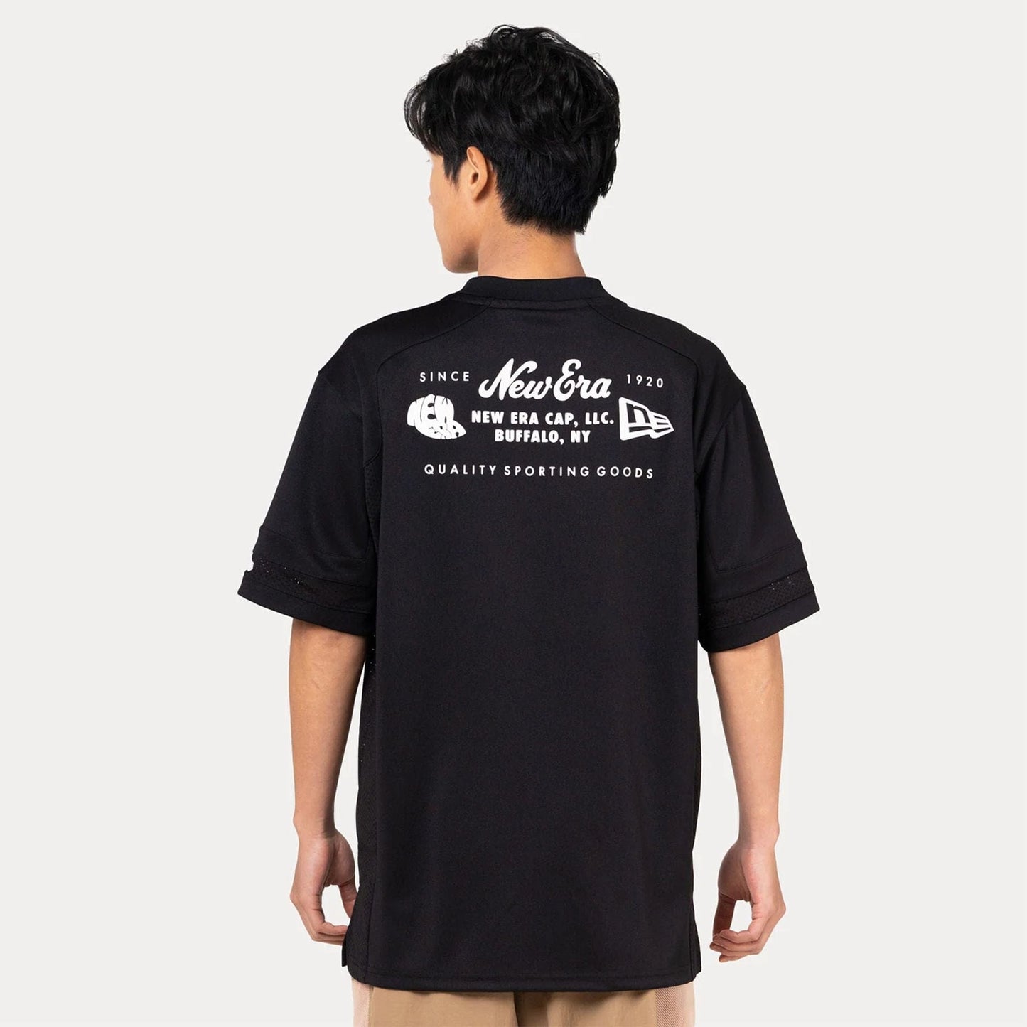 The Male model is wearing New Era Heritage Black Football Jersey 4