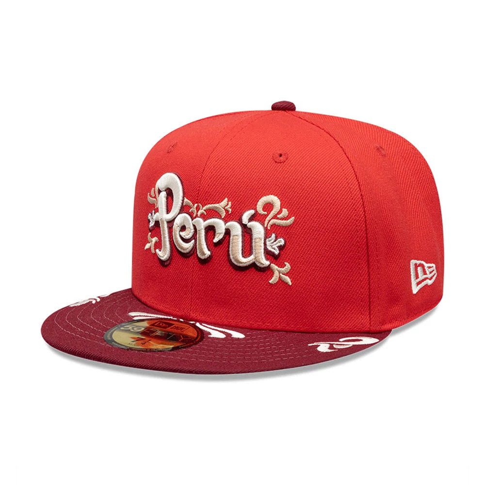 New Era Peru Red 59FIFTY Fitted Cap, front view showing raised cream embroidered Peru text with decorative details on a structured red crown, burgundy visor with stylized white designs, and gold 59FIFTY size sticker.