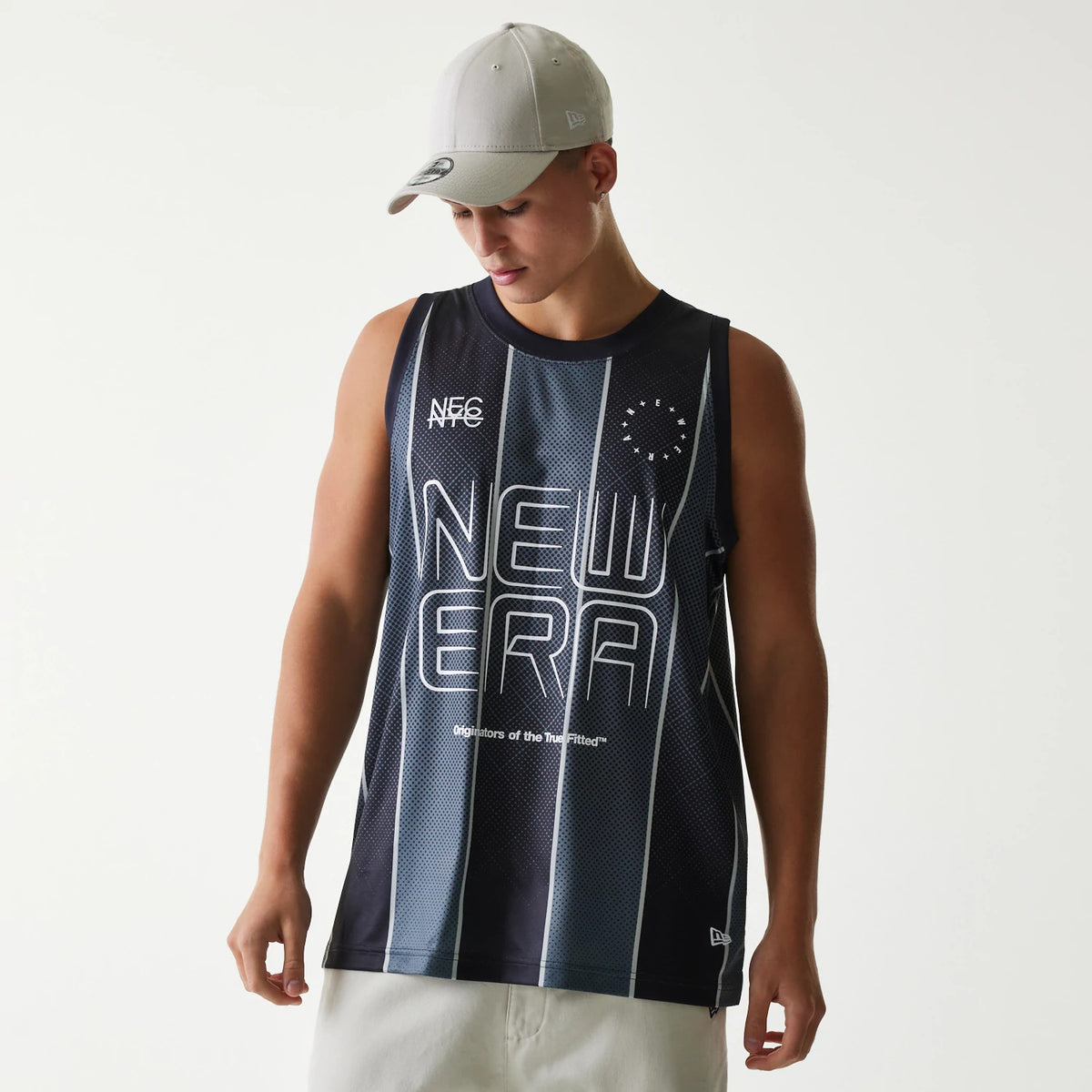 New Era City Sport Black Tank Top, front view on a model wearing a grey New Era 9FORTY cap, showing large white New Era lettering across the chest and a small New Era flag logo near the hem.