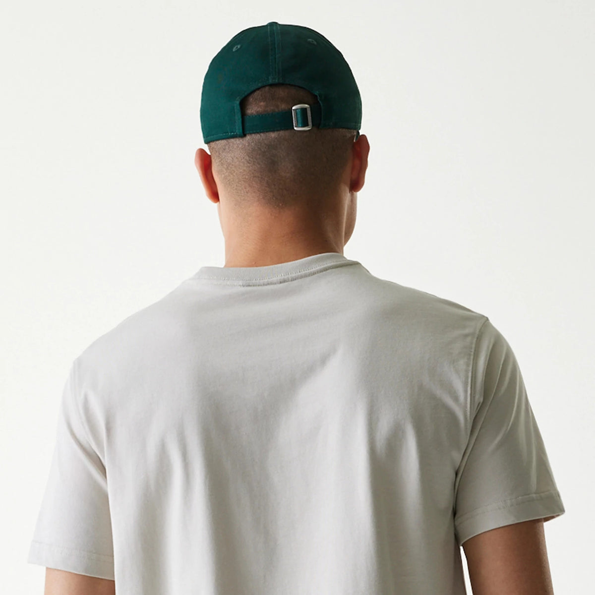 The Male model is wearing New Era Outdoor Earth Day Stone Side Pocket T-Shirt 7