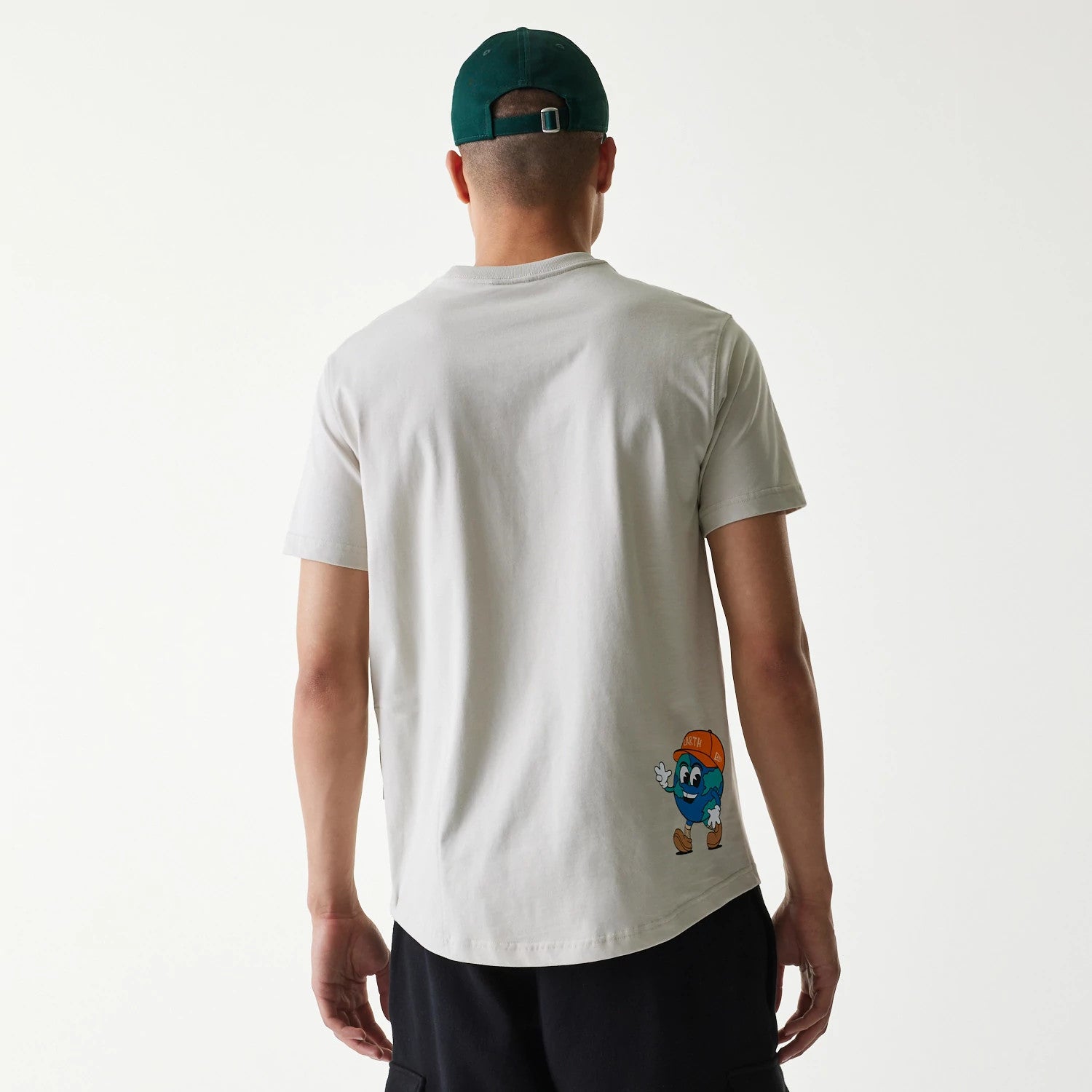 The Male model is wearing New Era Outdoor Earth Day Stone Side Pocket T-Shirt 2