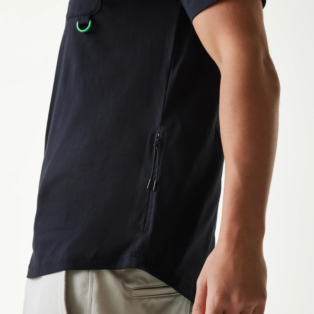 The Male model is wearing New Era Outdoor Earth Day Black Side Pocket T-Shirt 4