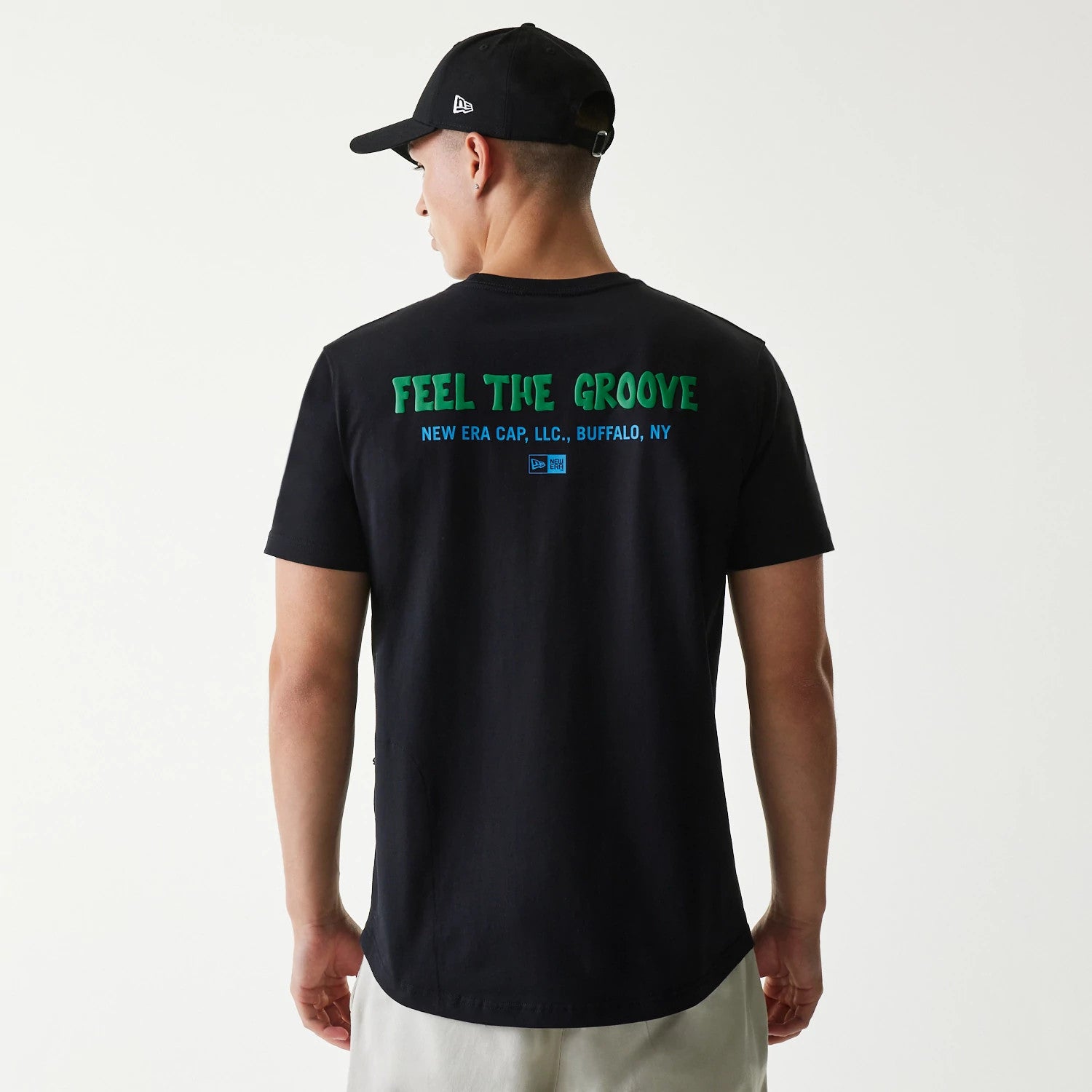 The Male model is wearing New Era Outdoor Earth Day Black Side Pocket T-Shirt 2
