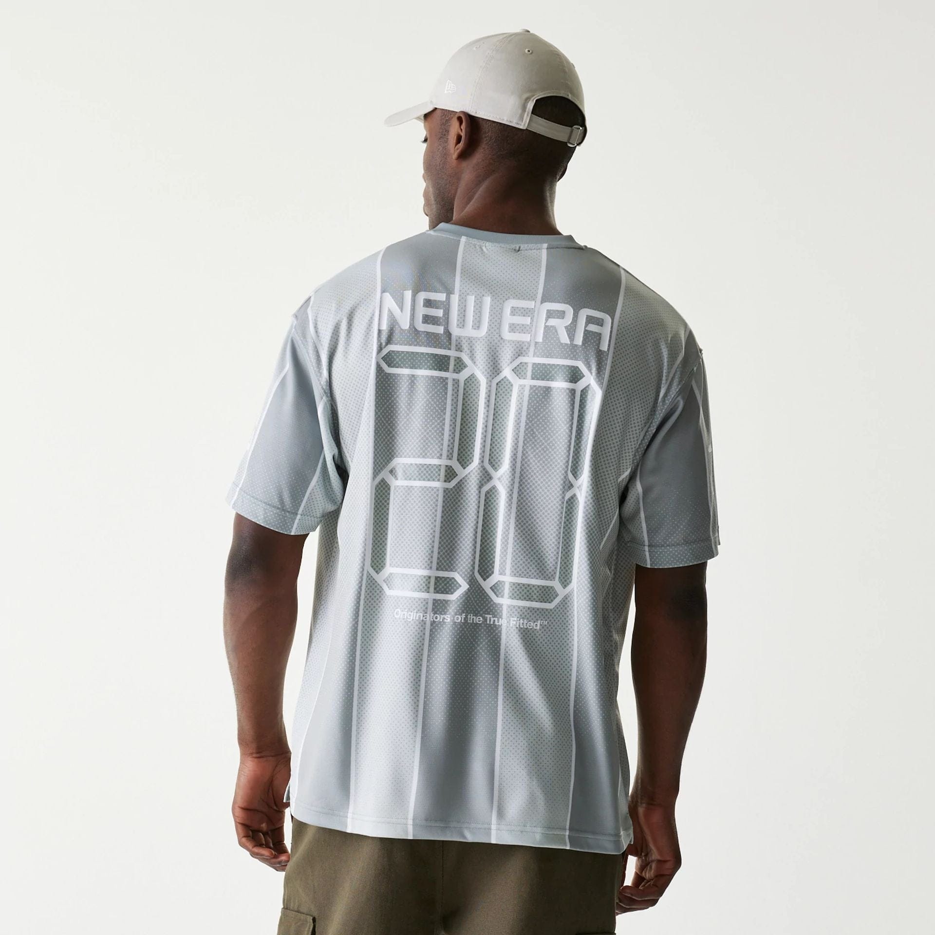 The Male model is wearing New Era City Sport Grey T-Shirt 2