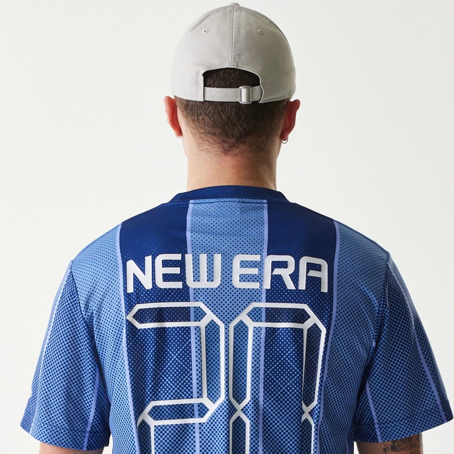 The Male model is wearing New Era City Sport Blue T-Shirt 6