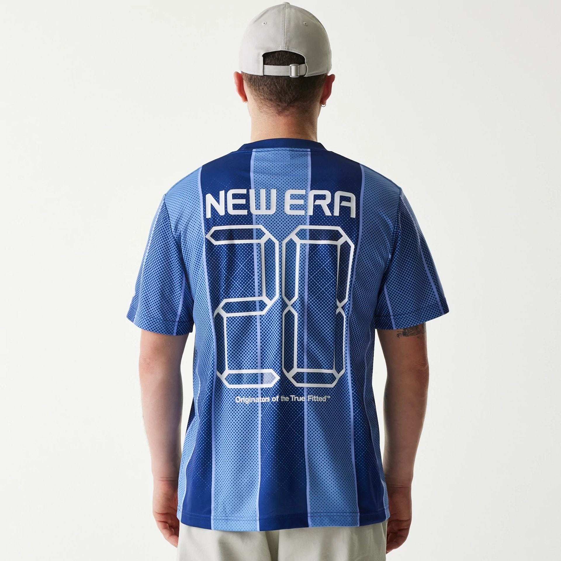 The Male model is wearing New Era City Sport Blue T-Shirt 2