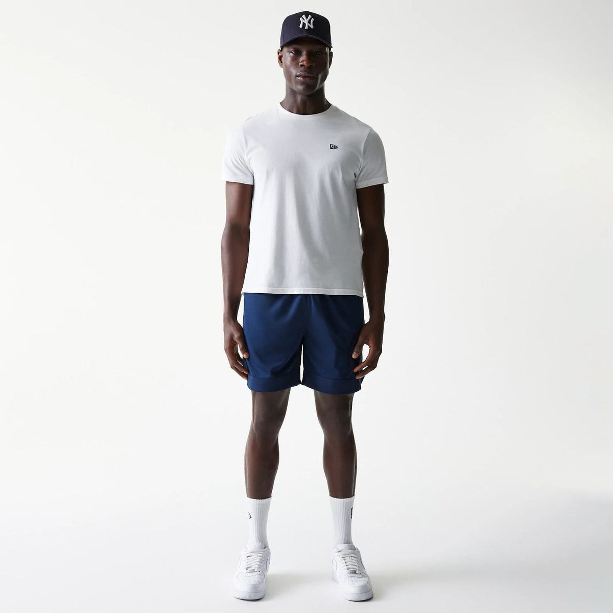 The Male model is wearing New York Yankees Tonal Pack Blue Shorts 8