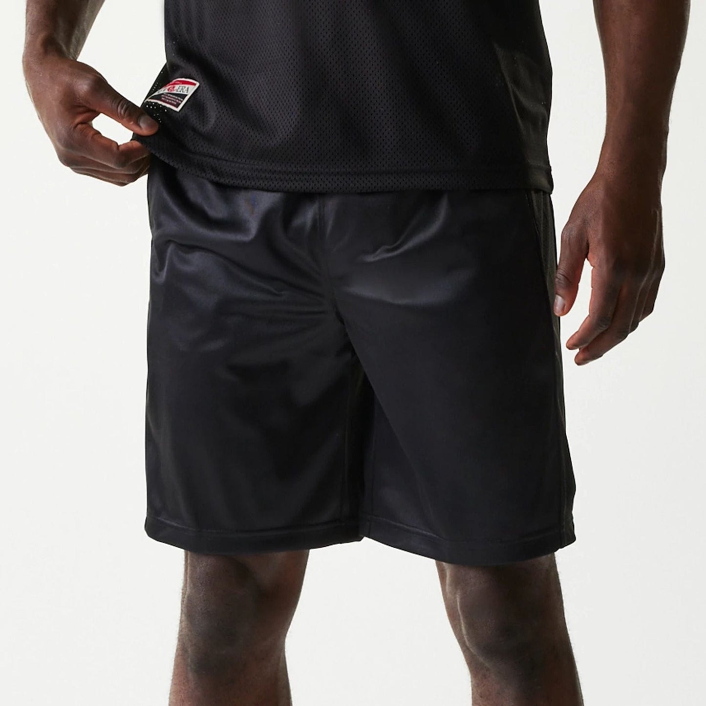 The Male model is wearing New Era Retro Sports Black Mesh Shorts 8