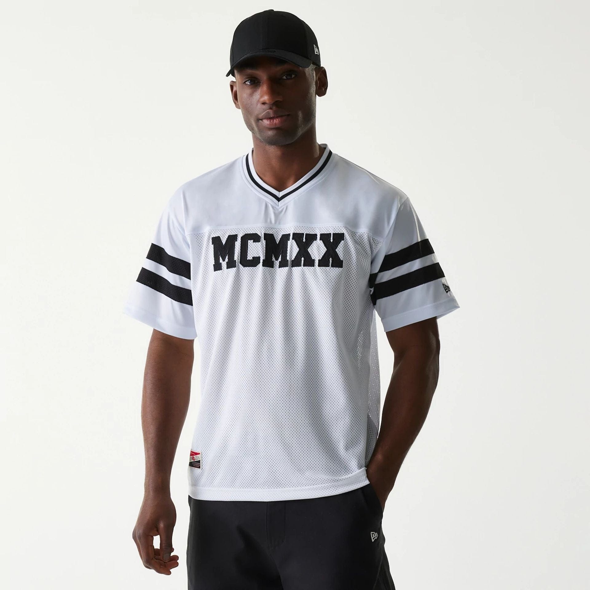 The Male model is wearing New Era Retro Sports White Mesh Jersey 1