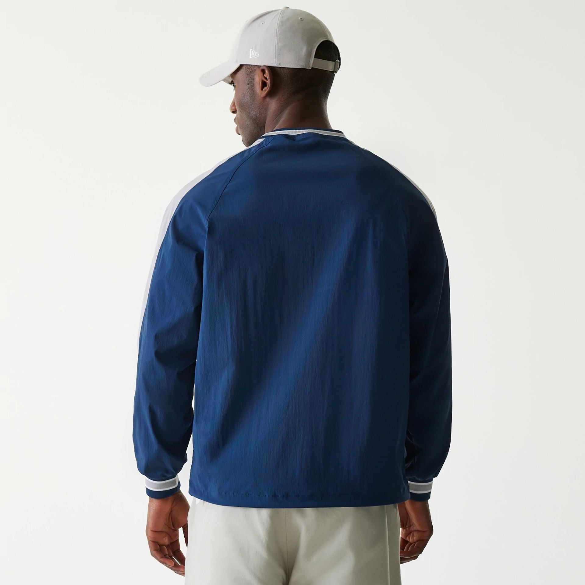 The Male model is wearing New York Yankees MLB Navy U Neck Pullover Windbreaker 2
