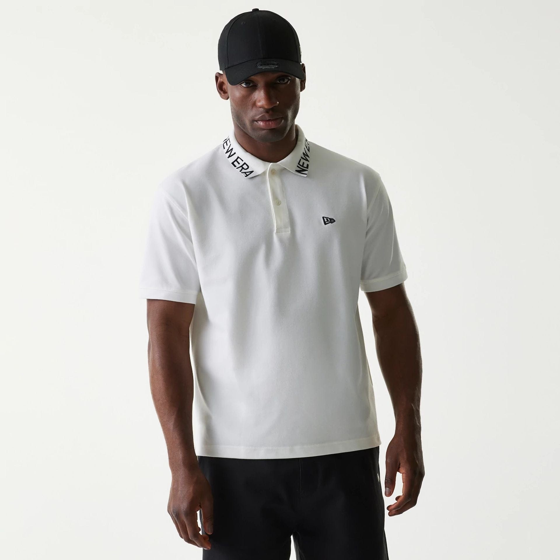 The Male model is wearing New Era Japan Collar Logo White Polo T-Shirt 1