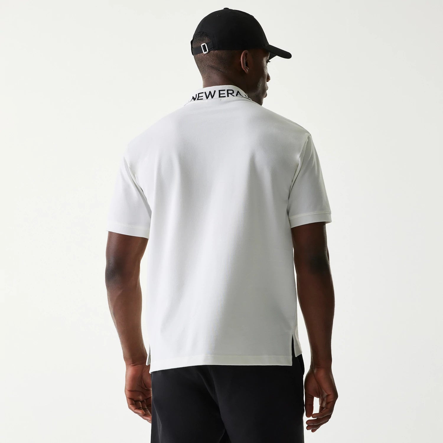 The Male model is wearing New Era Japan Collar Logo White Polo T-Shirt 2