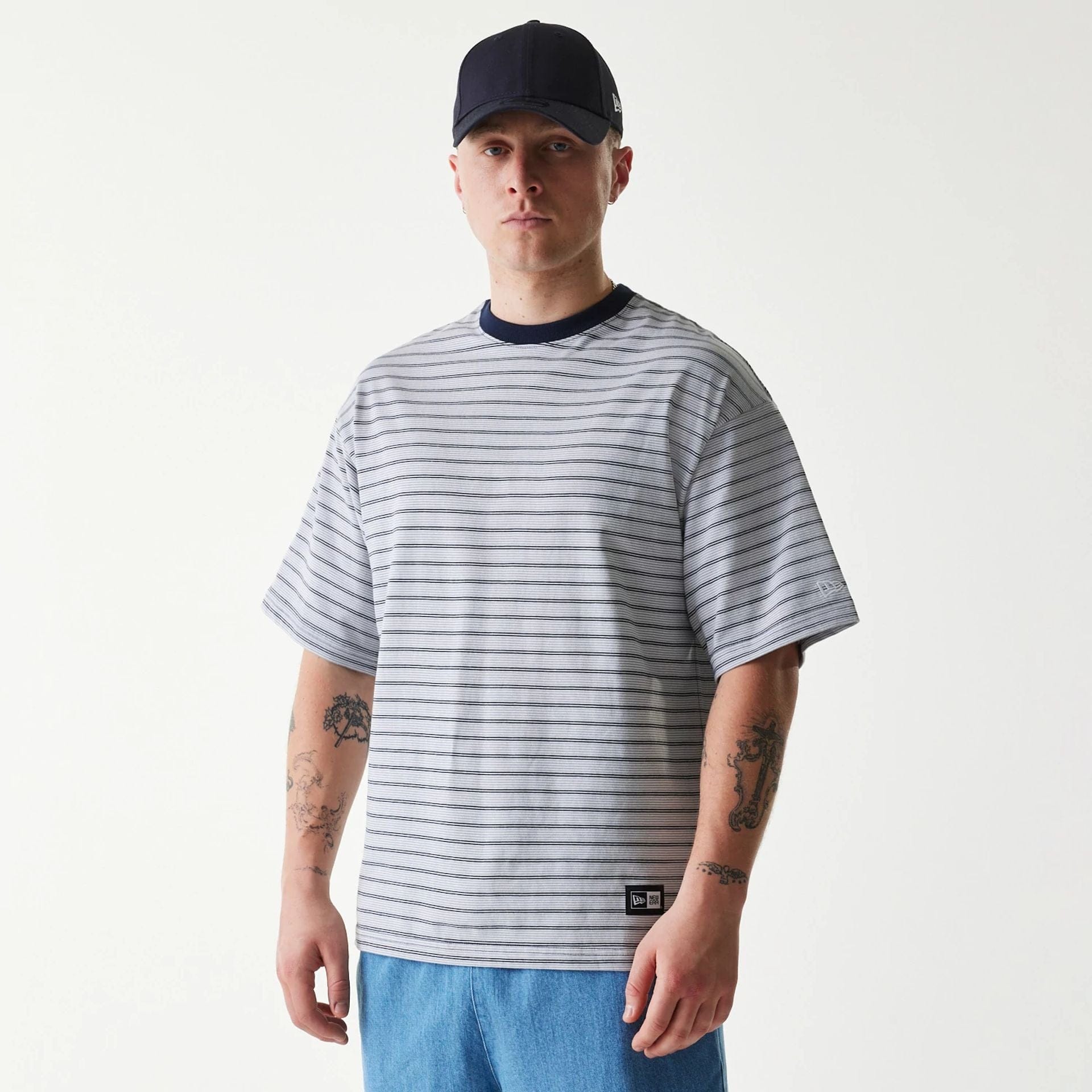 The Male model is wearing New Era Japan White T-Shirt 1