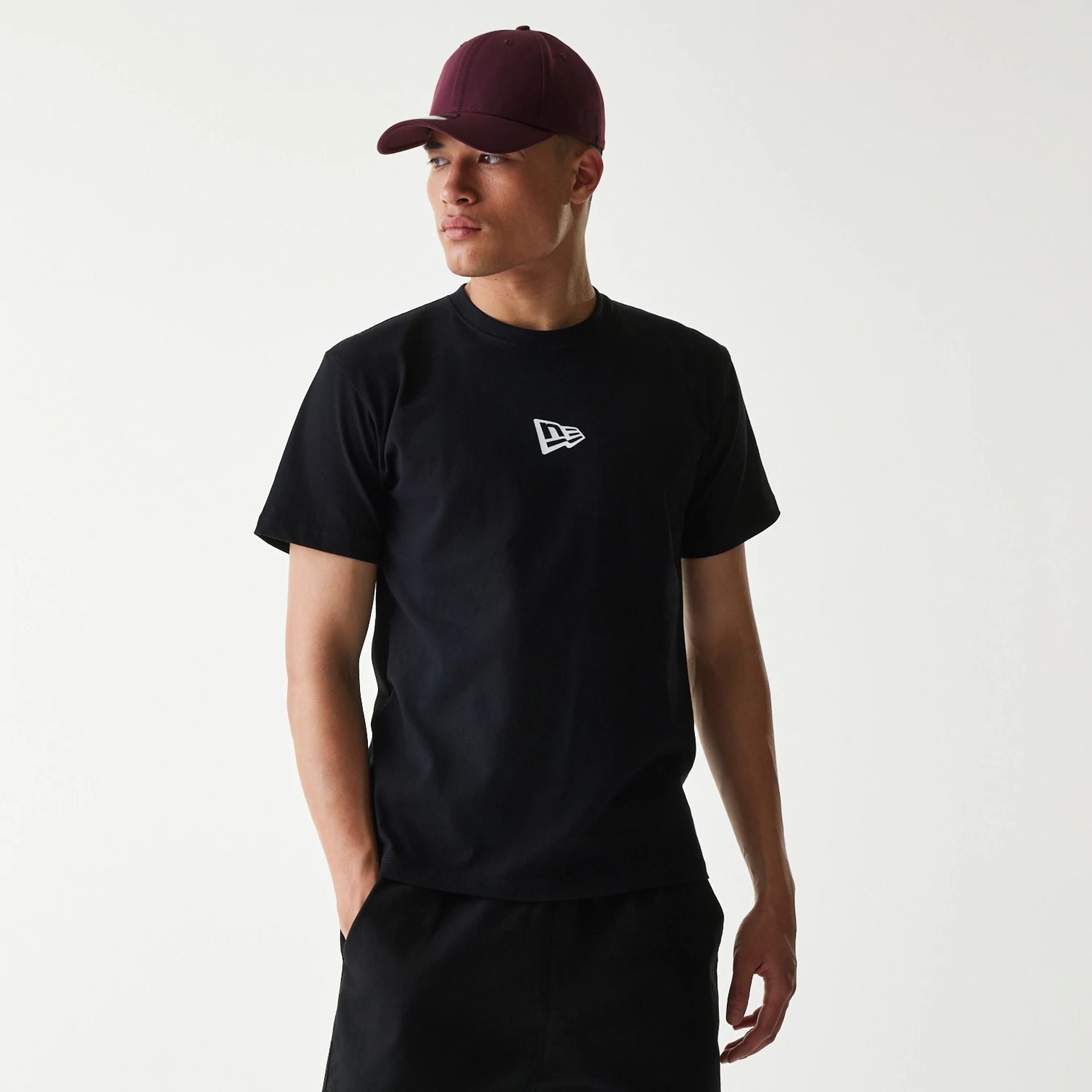 The Male model is wearing New Era Japan Mini Flag Logo Black T-Shirt 1