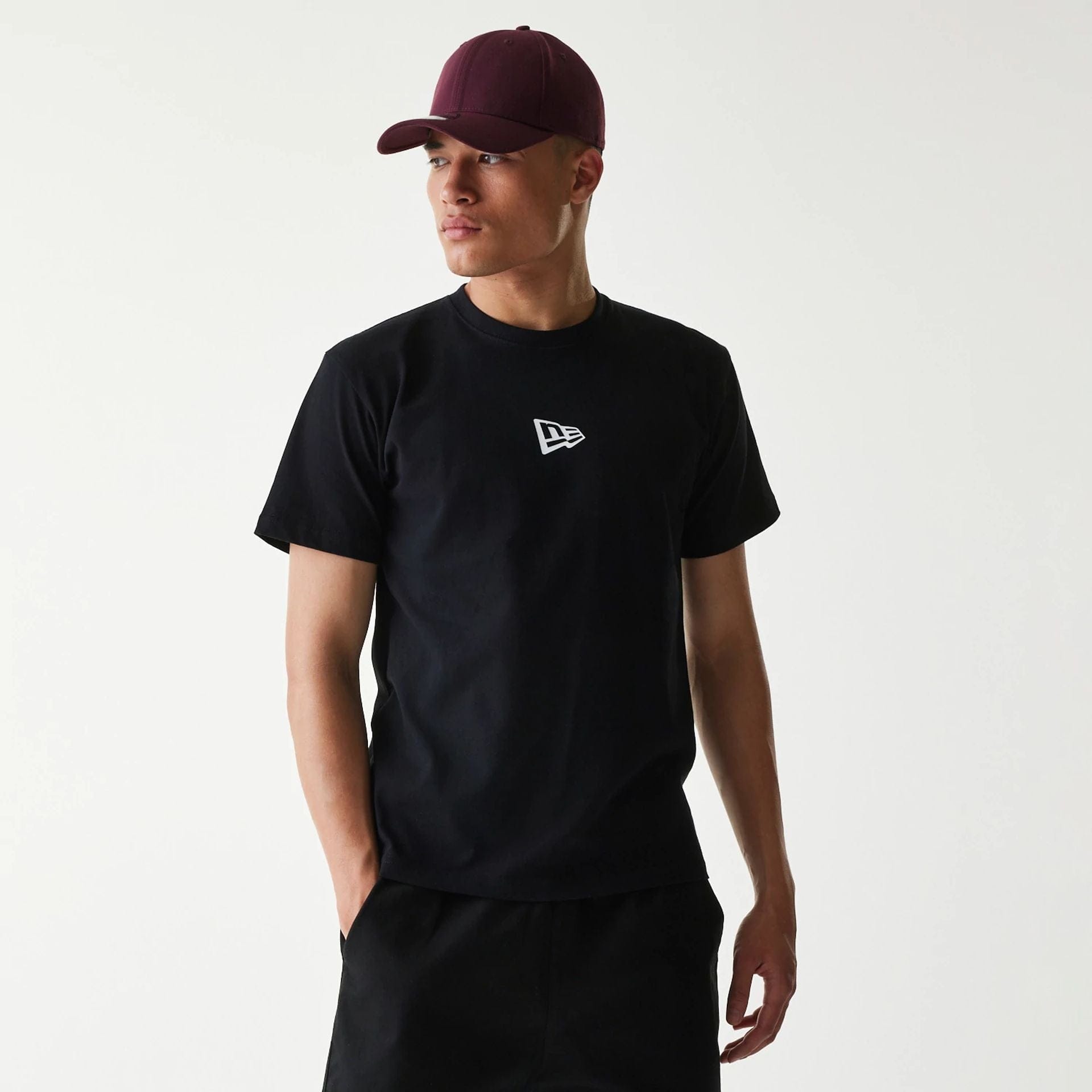 The Male model is wearing New Era Japan Mini Flag Logo Black T-Shirt 1