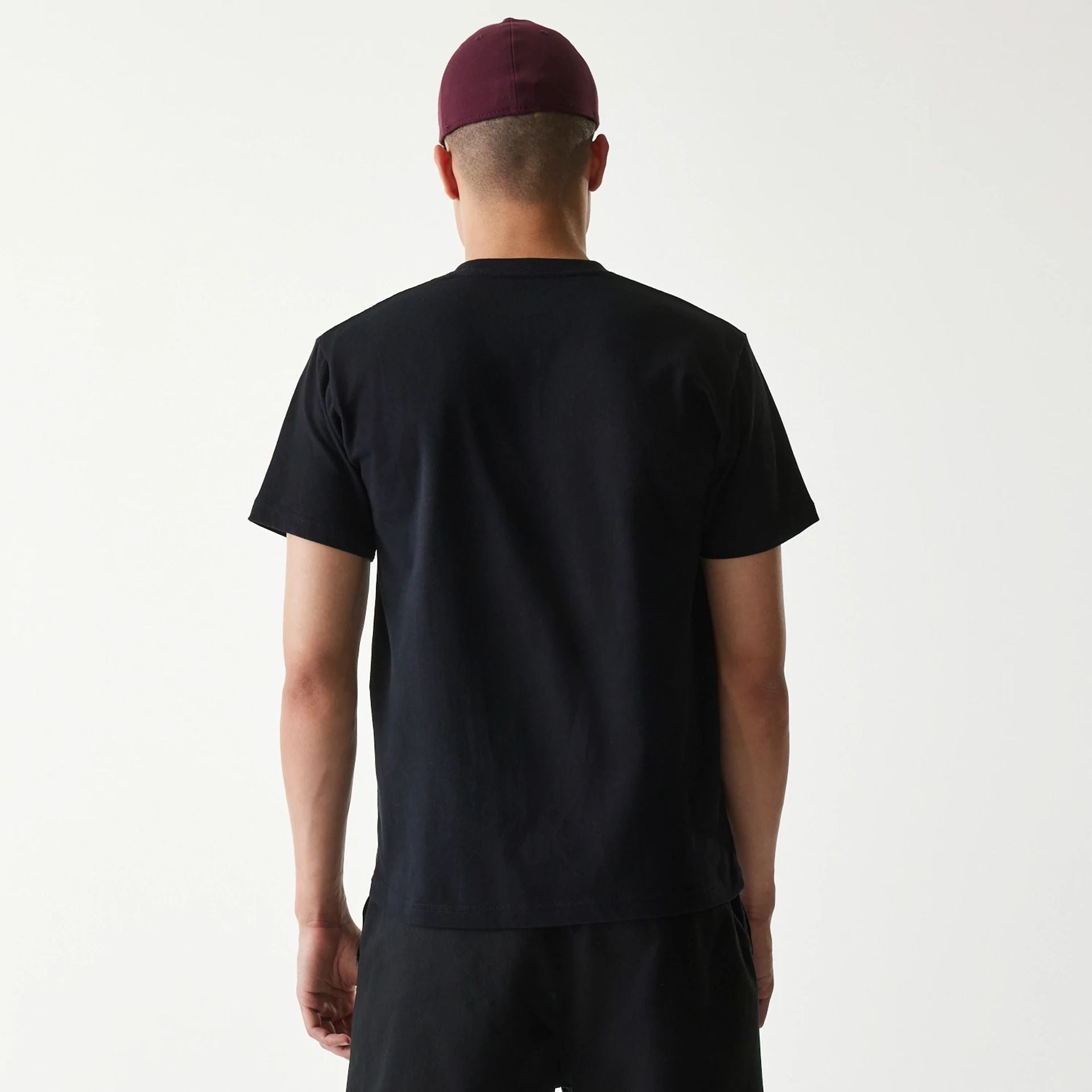 The Male model is wearing New Era Japan Mini Flag Logo Black T-Shirt 2