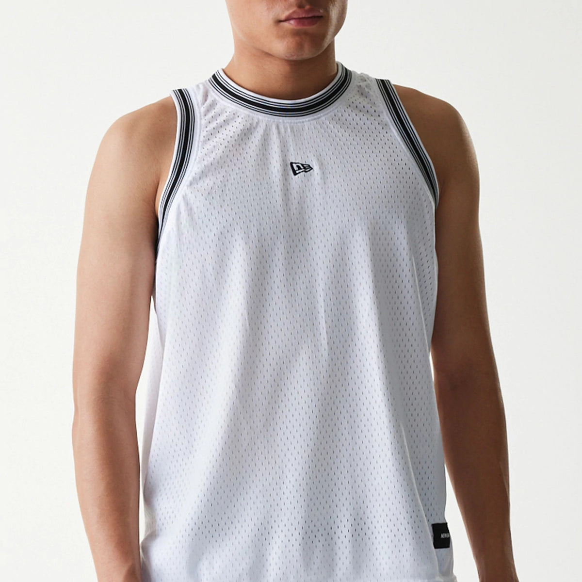New Era Japan Mesh White Sleeveless T-Shirt, front view showing the slim fit white mesh design with black and white striped trim on the collar and armholes, a raised New Era logo centred on the chest.