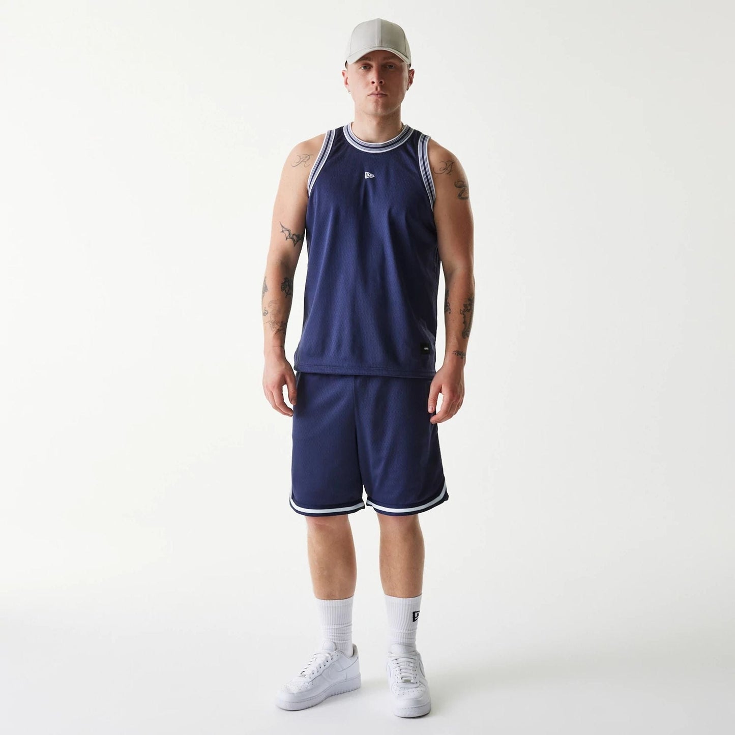 The Male model is wearing New Era Japan Mesh Navy Sleeveless T-Shirt 7