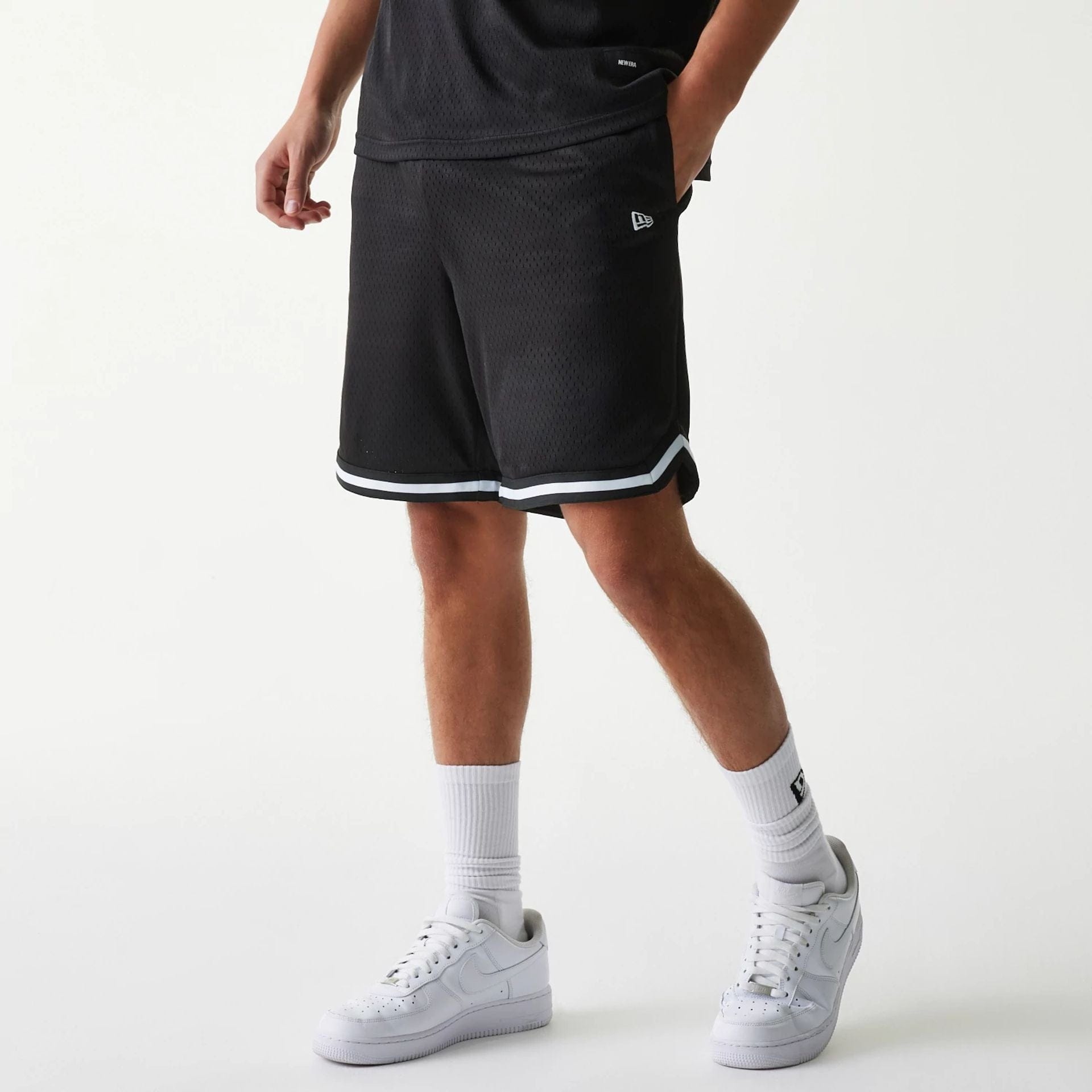 The Male model is wearing New Era Japan Mesh Black Shorts 1