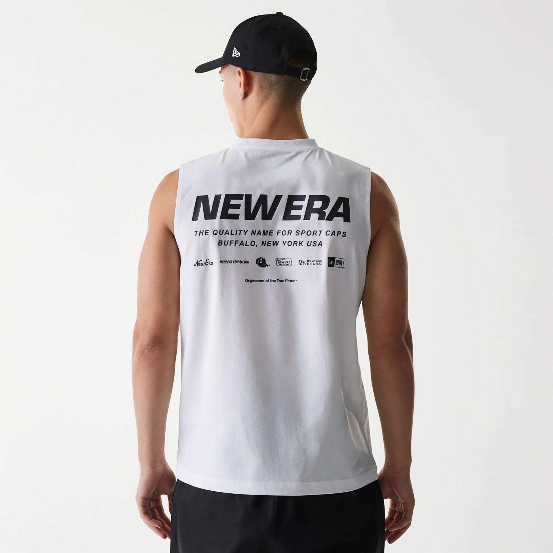 The Male model is wearing New Era Japan White Sleeveless T-Shirt 2