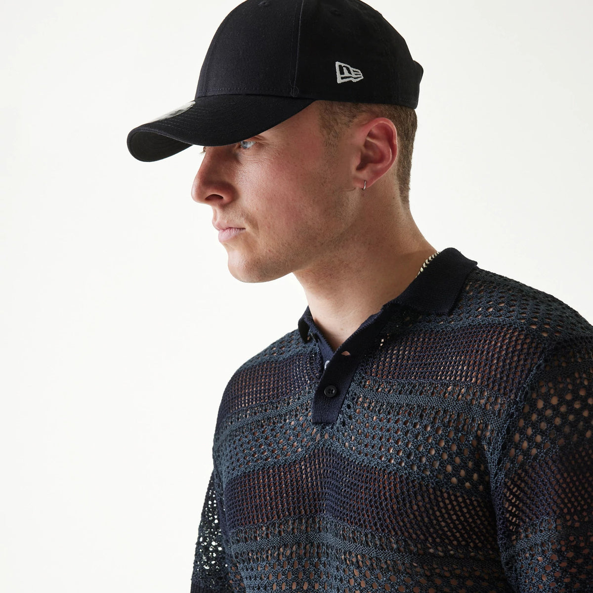 The Male model is wearing New Era Japan Mesh Black Polo T-Shirt 3
