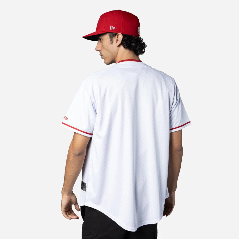 Mexico Diablos Mexico LMB On Field White On-Field Jersey, rear view on a model wearing a red cap showing the jersey's plain back with red trim on the collar and sleeves, and a New Era flag logo on the left sleeve.