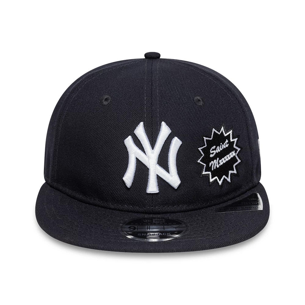 New York Yankees MLB X Saint Mxxxxxx Navy Retro Crown New Era 9FIFTY Snapback Adjustable Cap, front view showing raised white NY logo and starburst Saint Mxxxxxx embroidery on navy fabric, with a 9FIFTY size sticker on the visor.
