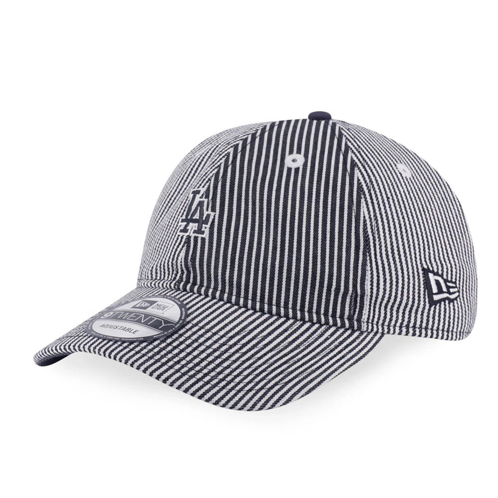 LA Dodgers MLB Patchwork Grey New Era 9TWENTY Adjustable Cap, three-quarter view showing the LA logo in white flat embroidery on the front panel, with the New Era flag logo on the left side and a 9TWENTY size sticker on the curved visor.